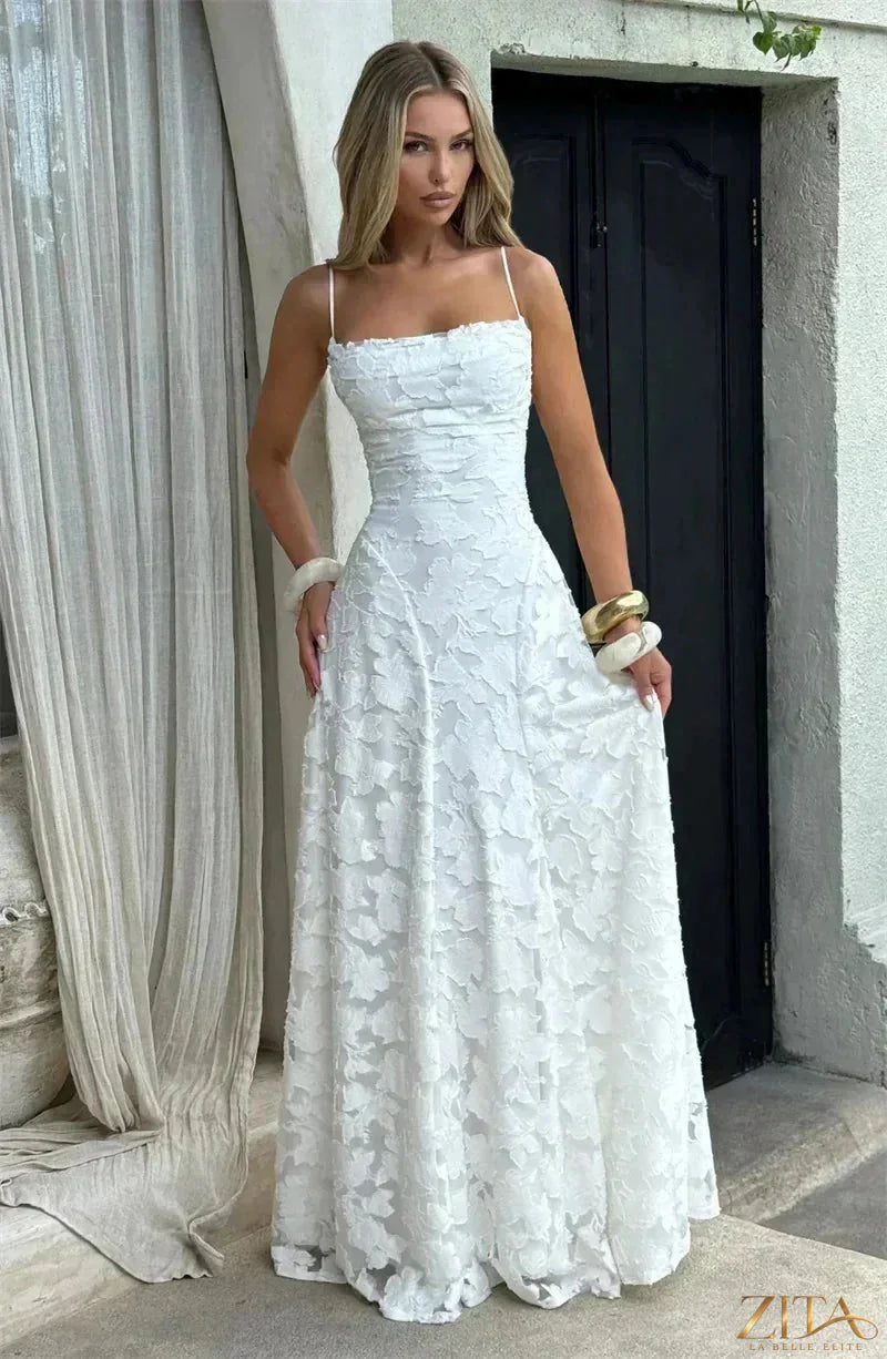 Backless spaghetti strap lace-up maxi evening dress by Zita La Belle Elite, featuring elegant flowy fabric and a stylish backless design.