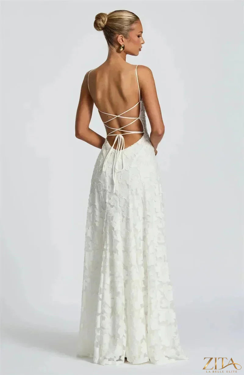 Backless spaghetti strap lace-up maxi evening dress by Zita La Belle Elite, featuring elegant lace details and flowing fabric.