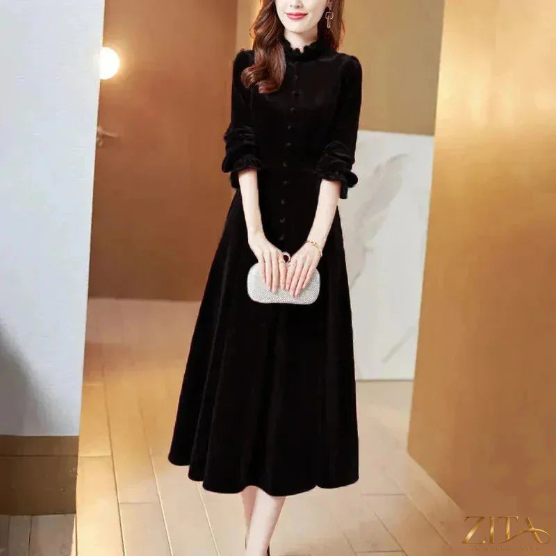 Wine red velvet women’s maxi dress with long sleeves by Zita La Belle Elite, featuring a flowing, elegant design.
