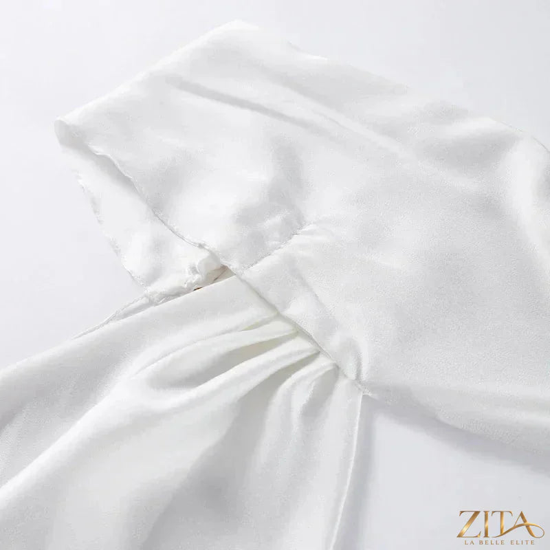Backless lace-up maxi dress by Zita La Belle Elite featuring a sleeveless design and elegant ribbon details for evening wear.