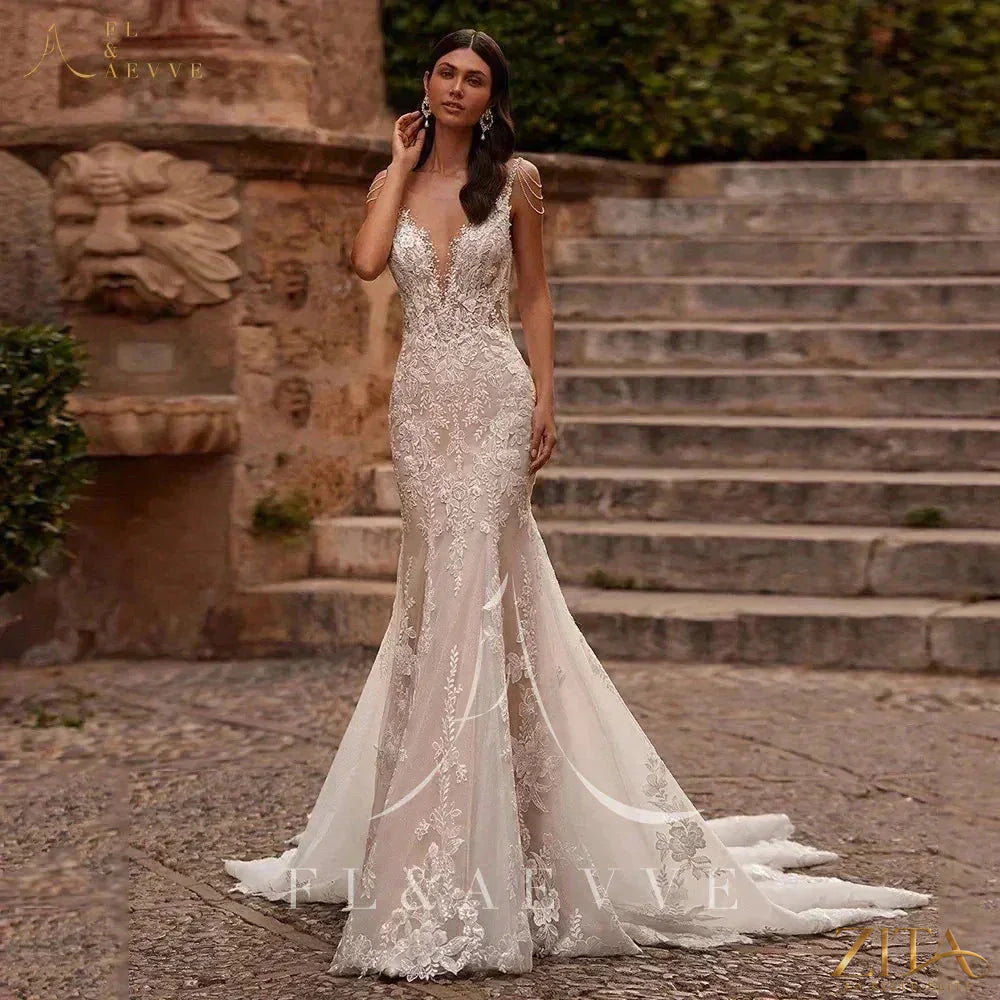Elegant Zita La Belle Elite luxury lace spaghetti strap wedding gown with intricate lace details for beach wedding attire.