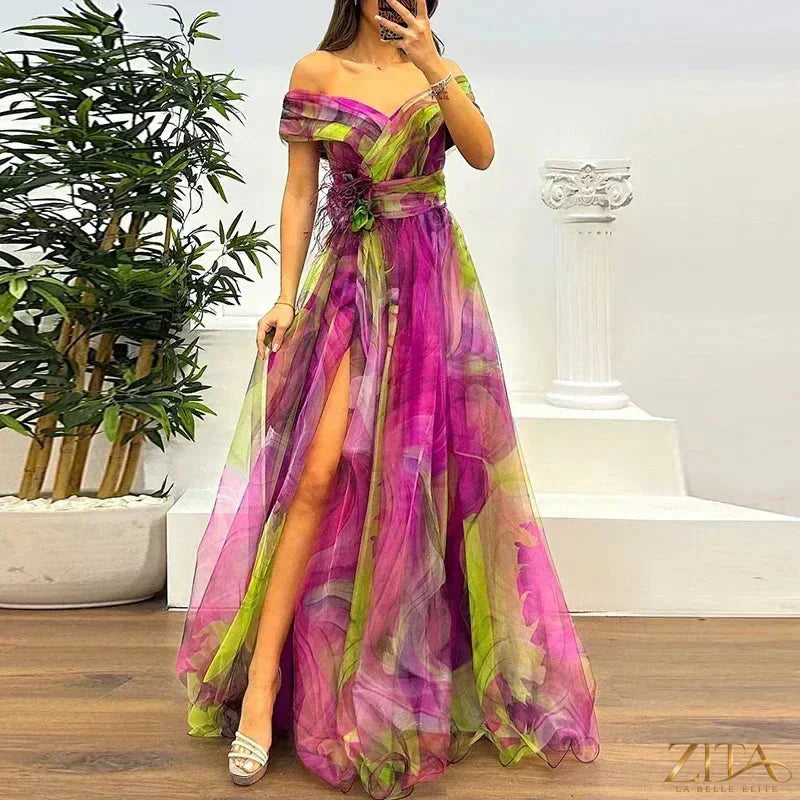 Elegant one-shoulder pleated gala evening dress with slit by Zita La Belle Elite, featuring flowing fabric and sophisticated design.