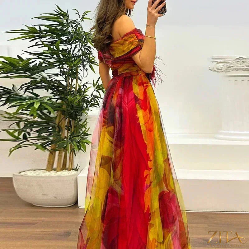 Elegant one-shoulder pleated evening gown with side slit by Zita La Belle Elite, shown in deep fabric with flowing design.