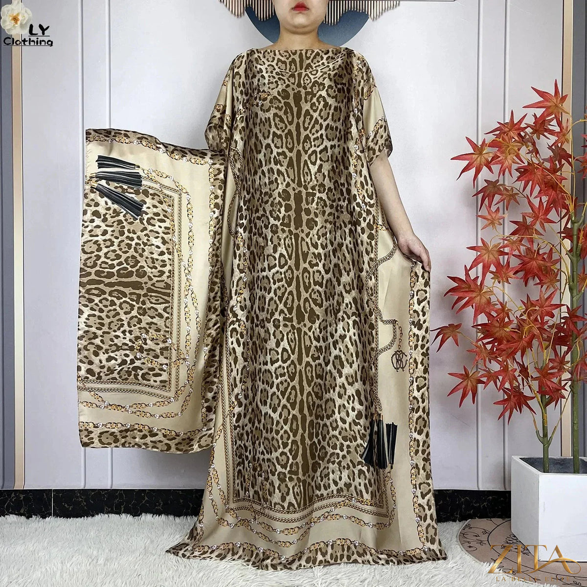 Women’s printed silk loose maxi summer dress with belt and turban, featuring vibrant patterns and flowing fabric by Zita La Belle Elite.