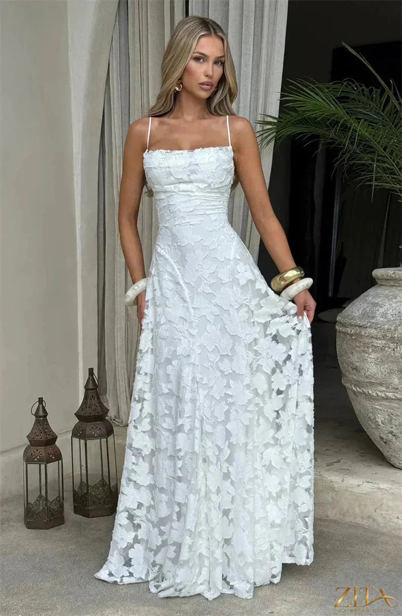 Elegant backless spaghetti strap lace-up maxi evening dress by Zita La Belle Elite, featuring flowing fabric and stylish design.
