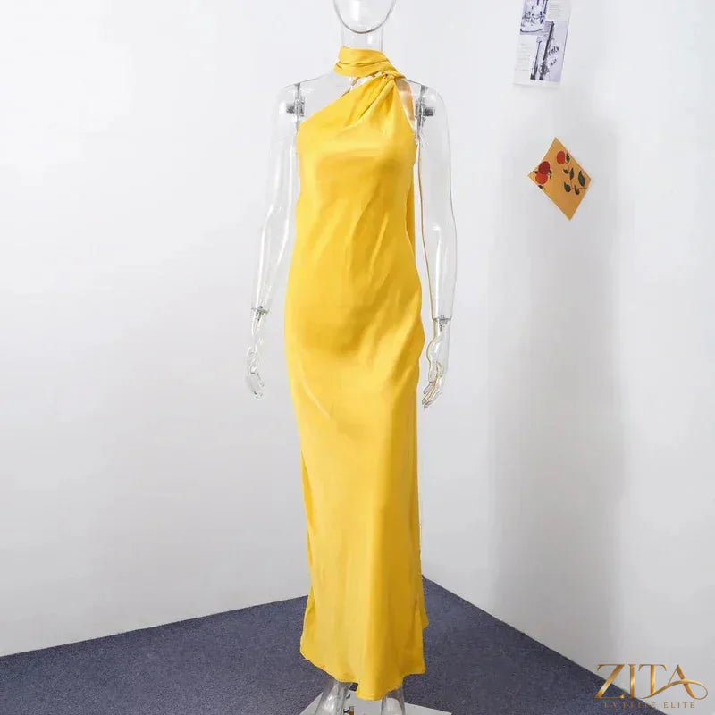 Backless lace-up maxi dress by Zita La Belle Elite featuring a sleeveless design and elegant ribbon detail for evening wear.