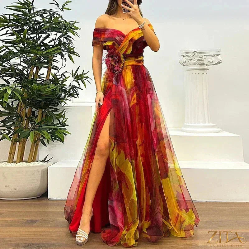 Elegant one-shoulder pleated evening dress with slit by Zita La Belle Elite, featuring flowing fabric and sophisticated design.
