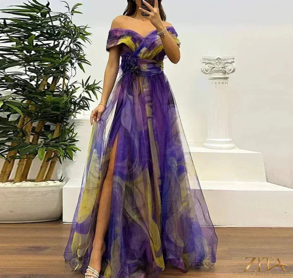 Elegant one-shoulder pleated gala evening dress with thigh-high slit by Zita La Belle Elite, shown in a smooth fabric with flowing design.