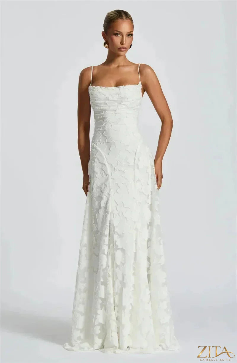 Elegant backless spaghetti strap lace-up maxi evening dress by Zita La Belle Elite, featuring flowing fabric and stylish design.