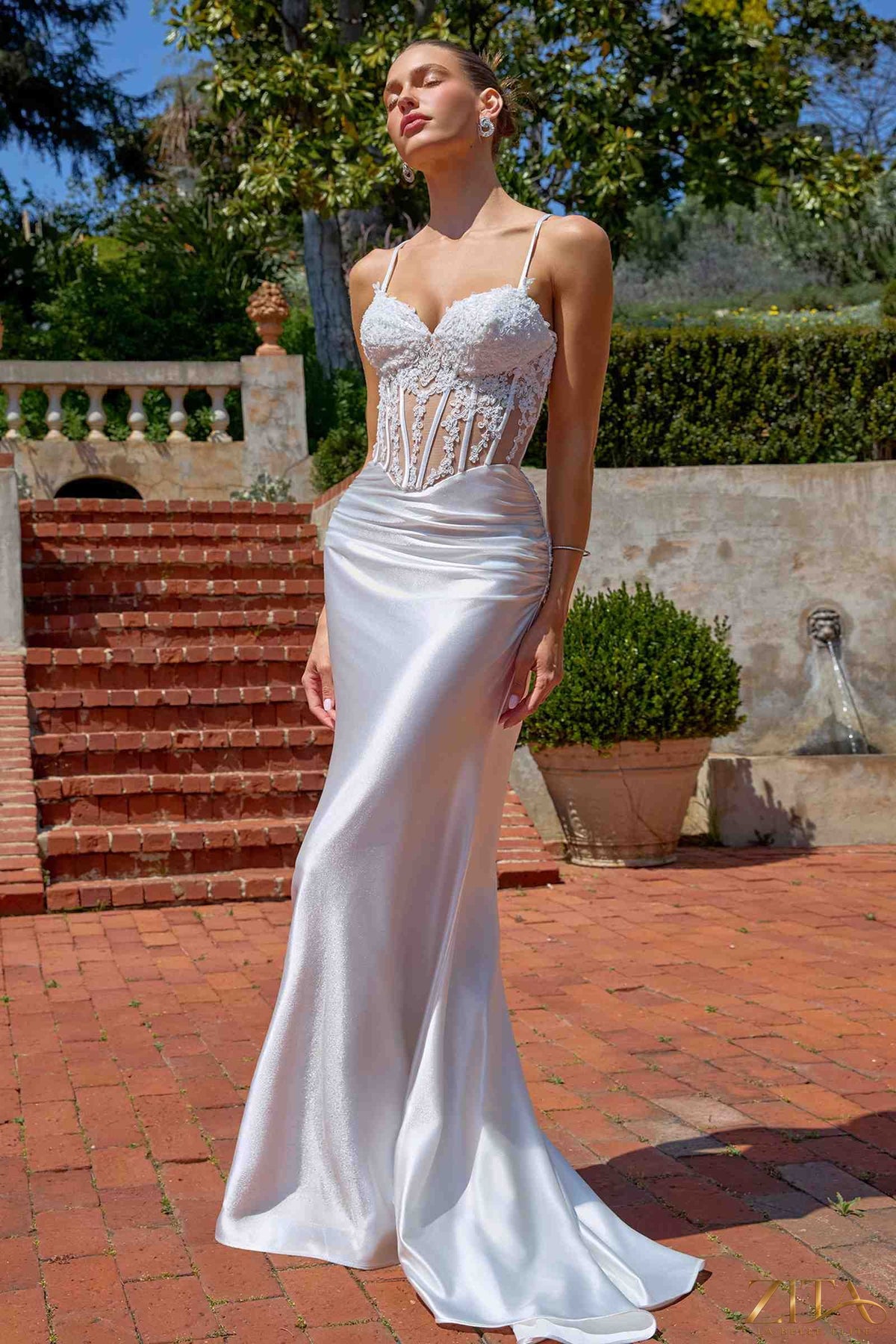White fitted mermaid evening gown with sheer corset bodice by Zita La Belle Elite, front view of the Amoris T819W dress.