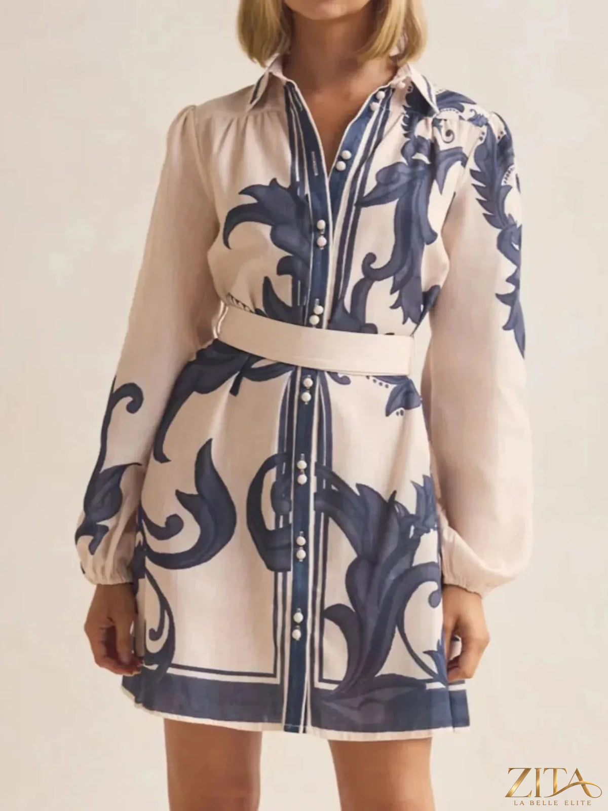 Printed long sleeve shirt dress by Trendsi featuring a stylish, casual design with a button-up front and collar.