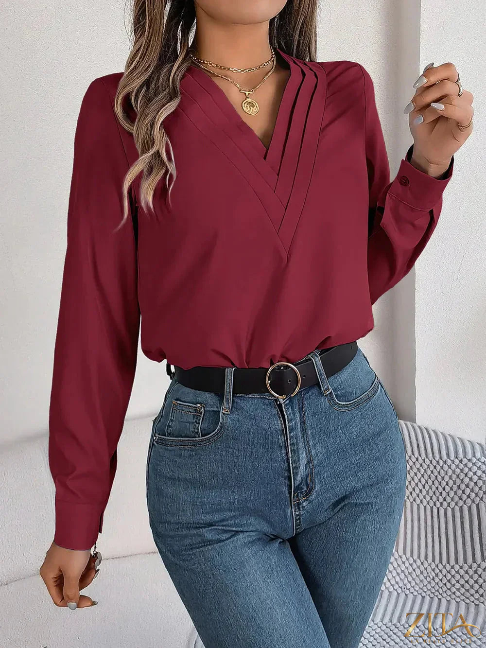 Zita La Belle Elite V-neck long sleeve blouse in soft fabric, shown in a close-up of the stylish neckline and sleeve details.