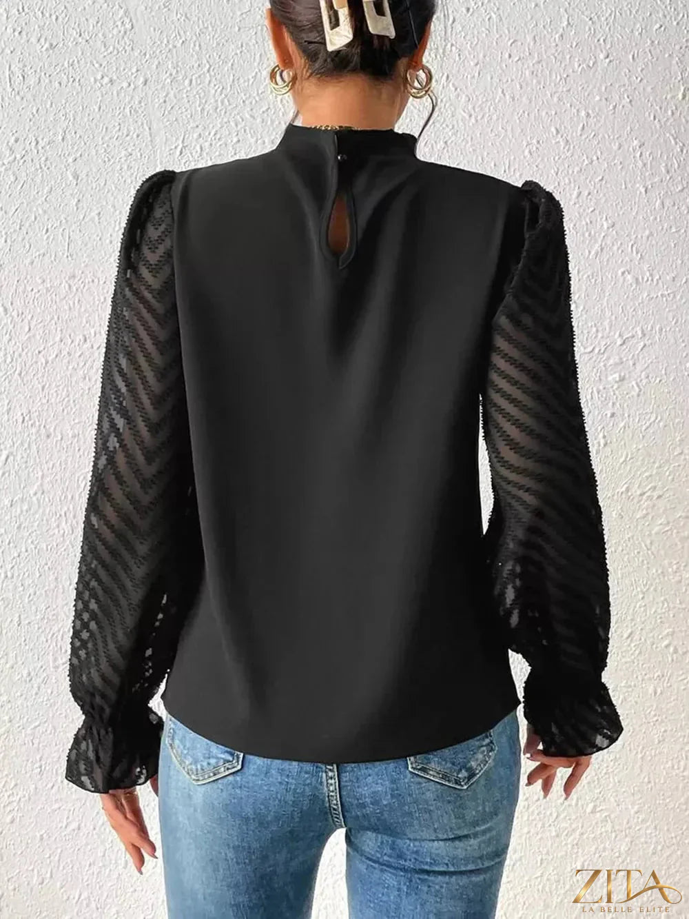 Zita La Belle Elite mock neck blouse with flounce sleeves, styled in soft fabric, showcasing elegant and fashionable design.