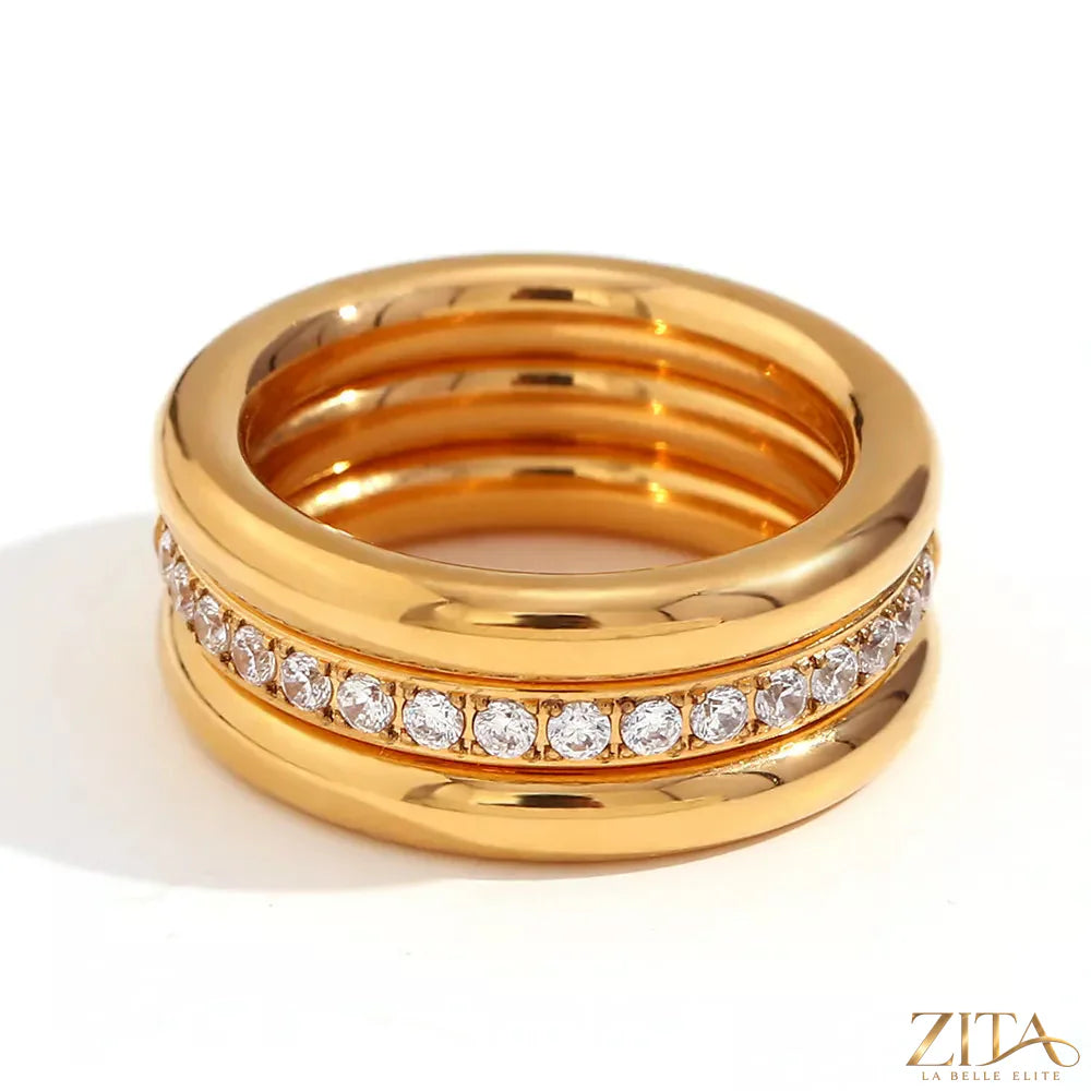 Three stainless steel zircon rings from Zita La Belle Elite, featuring shiny finishes and intricate designs in a set.