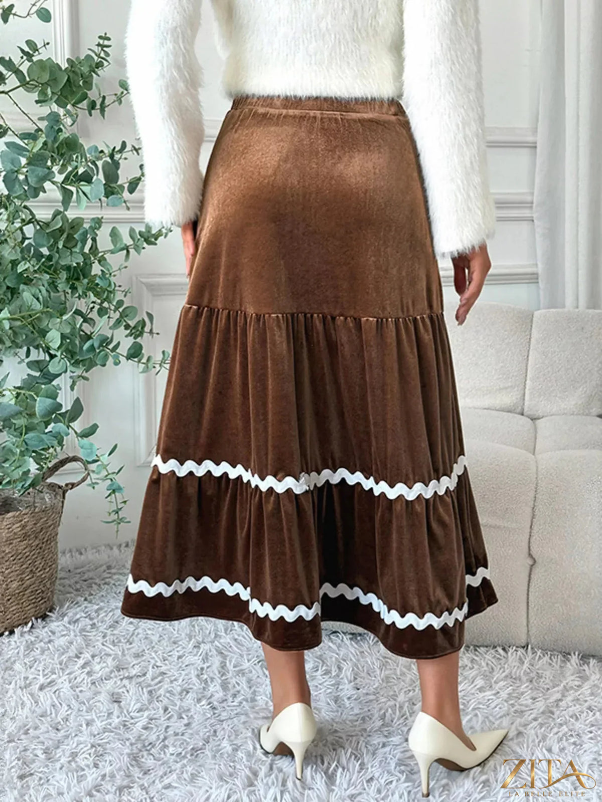Velvet tiered midi skirt by Trendsi, featuring a flowing design with multiple layers and a soft velvet fabric in a stylish silhouette.