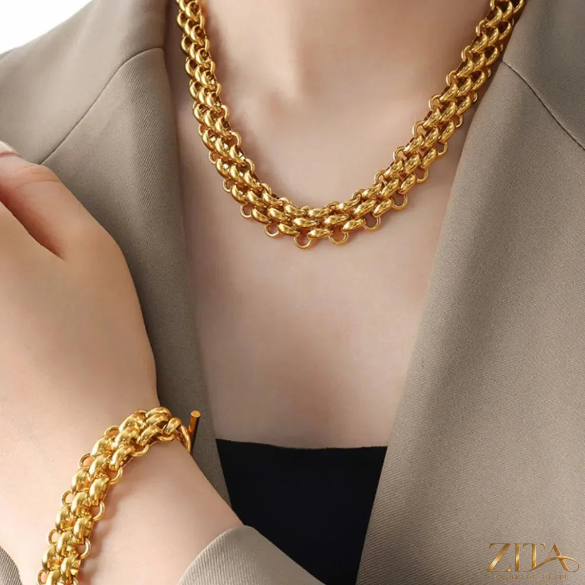 Gold chain link jewelry set featuring a matching necklace and bracelet with sleek, interconnected links.