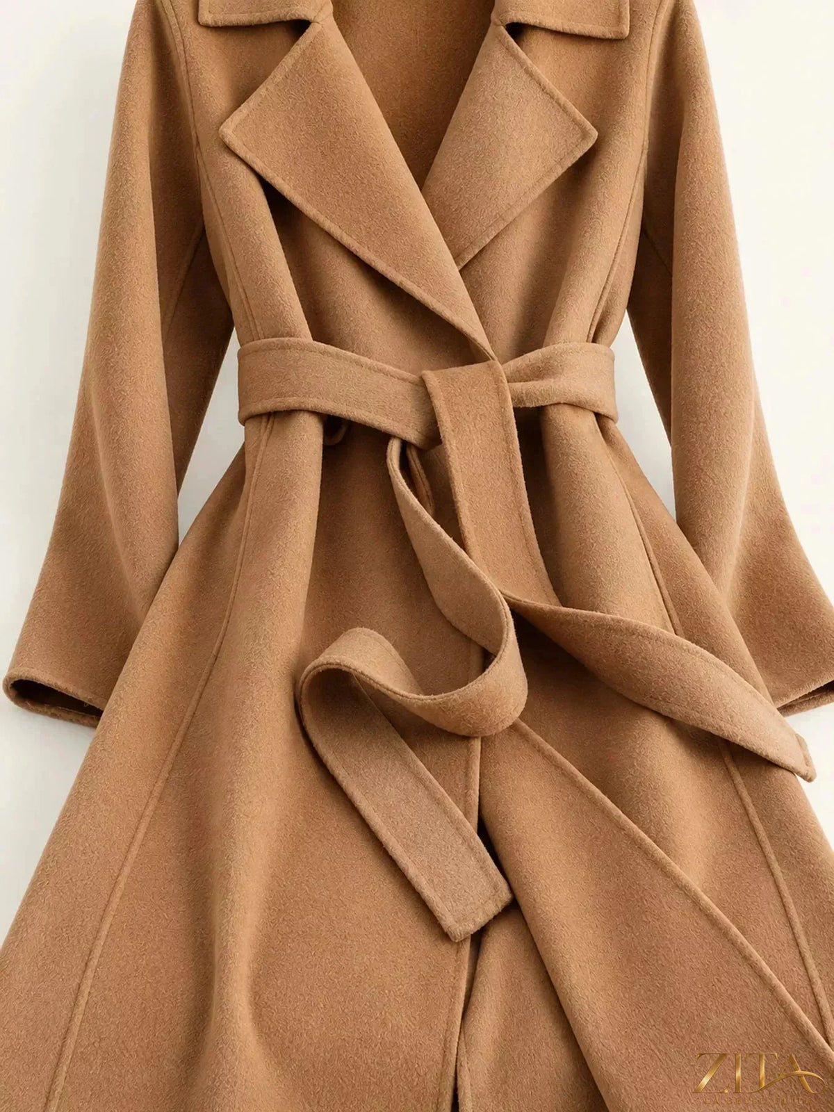 Zita La Belle Elite longline wool coat with waist-defining belt, showcasing a classic stylish outerwear piece in neutral tones.
