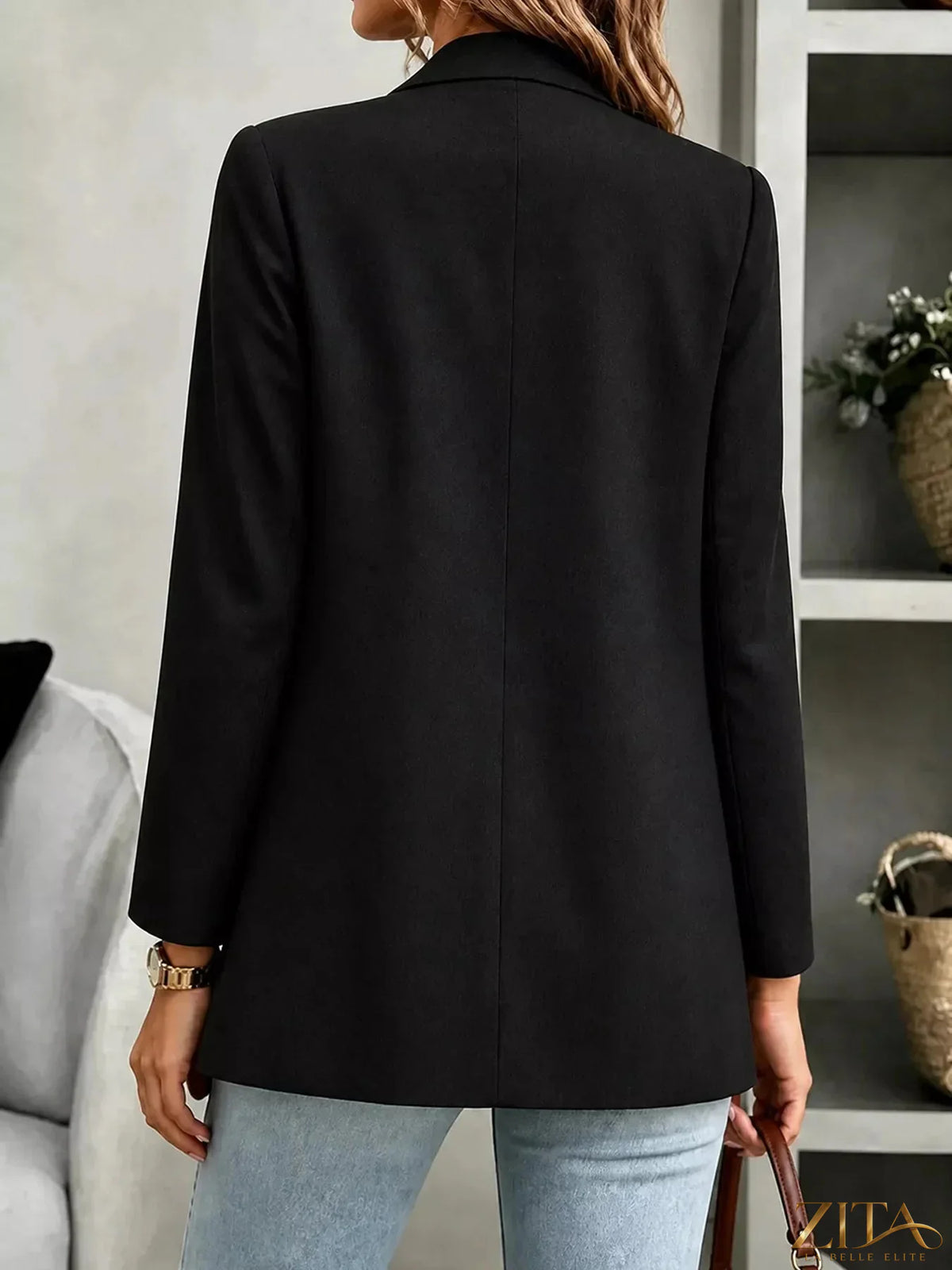 Open-front long sleeve blazer by Trendsi featuring a tailored fit and classic design, shown in a neutral color on a model.