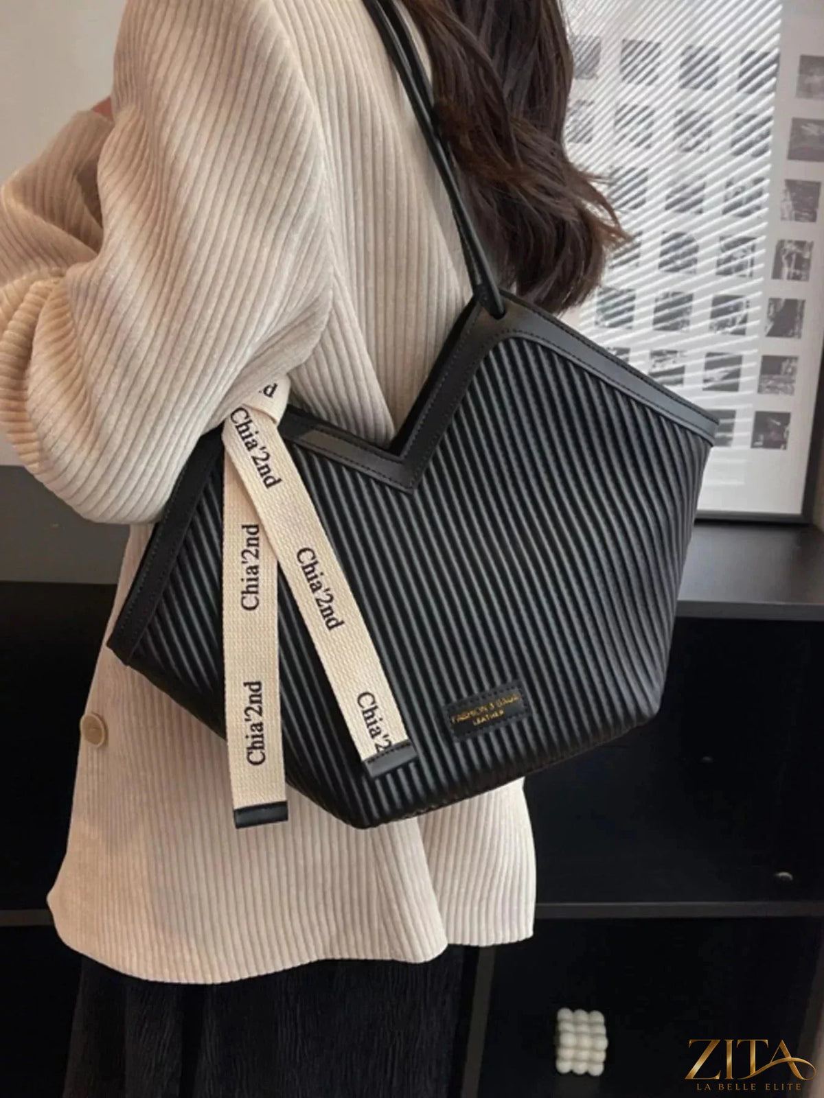 Textured leather Zita La Belle Elite shoulder bag with gold-tone hardware and adjustable strap, showcasing stylish craftsmanship.