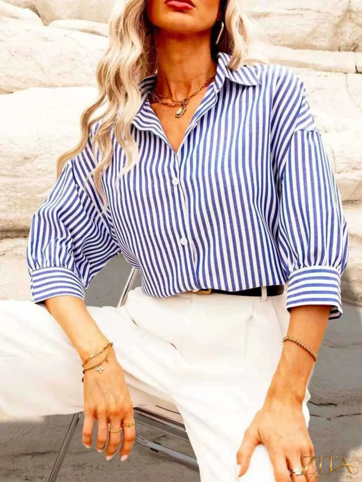 Zita La Belle Elite striped button-down shirt with blue and white vertical stripes, displayed flat on a white background.