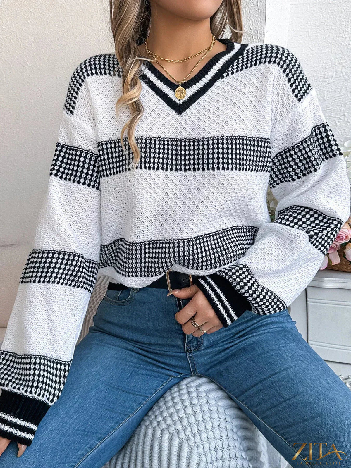 Contrast striped V-neck sweater from Trendsi featuring a stylish V-neck and bold stripe pattern in various colors.