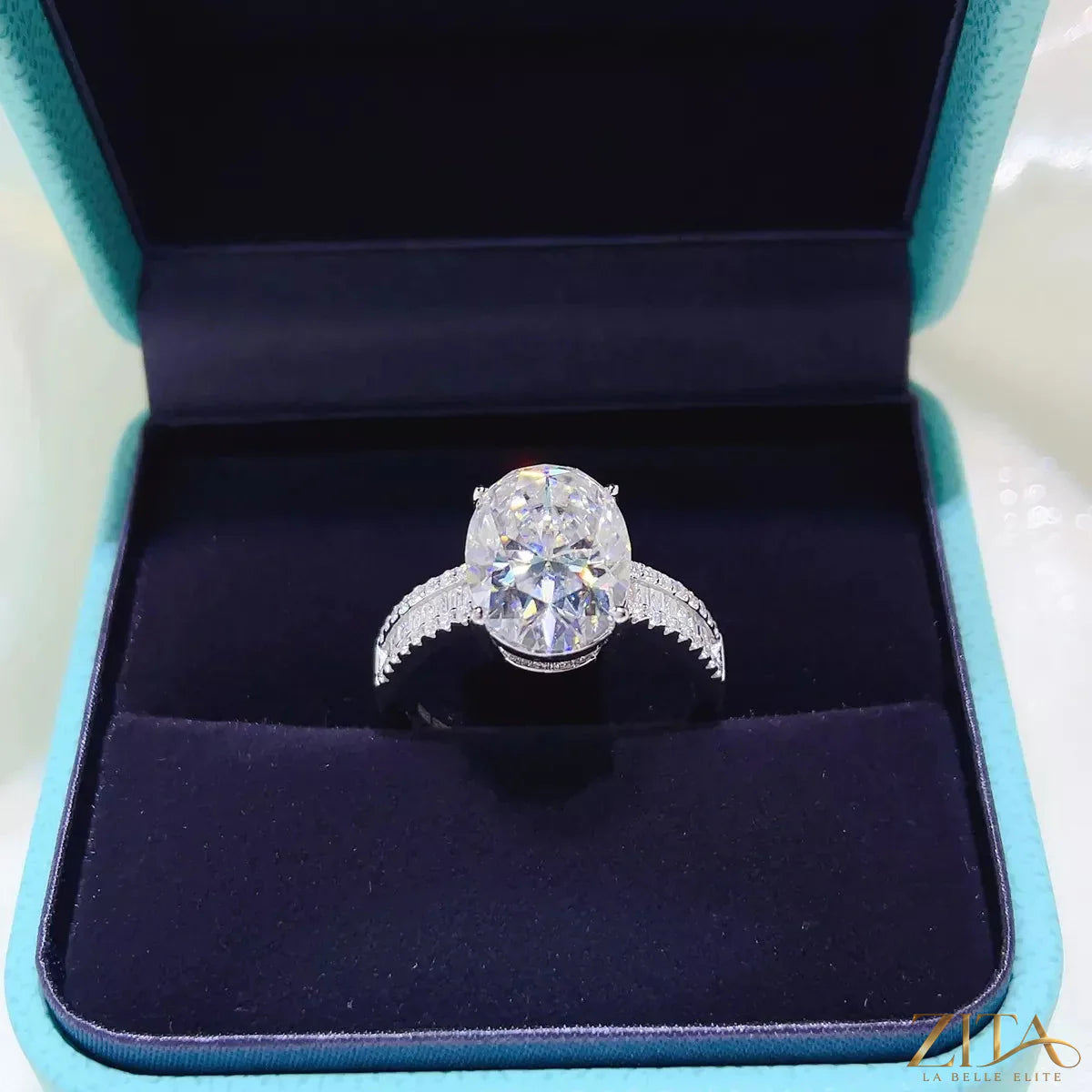 Sterling silver moissanite ring with an 8-carat gemstone, featuring a sleek band and sparkling center stone.