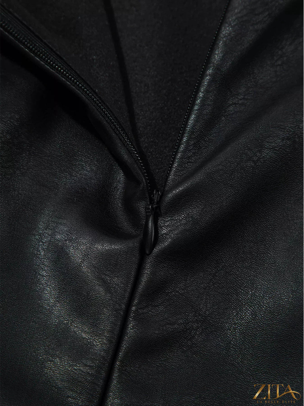Vegan leather sleeveless mini dress by Zita La Belle Elite, shown on a model with a fitted silhouette and stylish design.