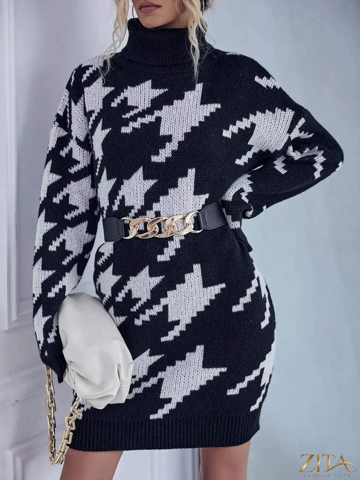 Houndstooth pattern turtleneck sweater dress by Trendsi, featuring a cozy knit fabric and classic black-and-white houndstooth design.
