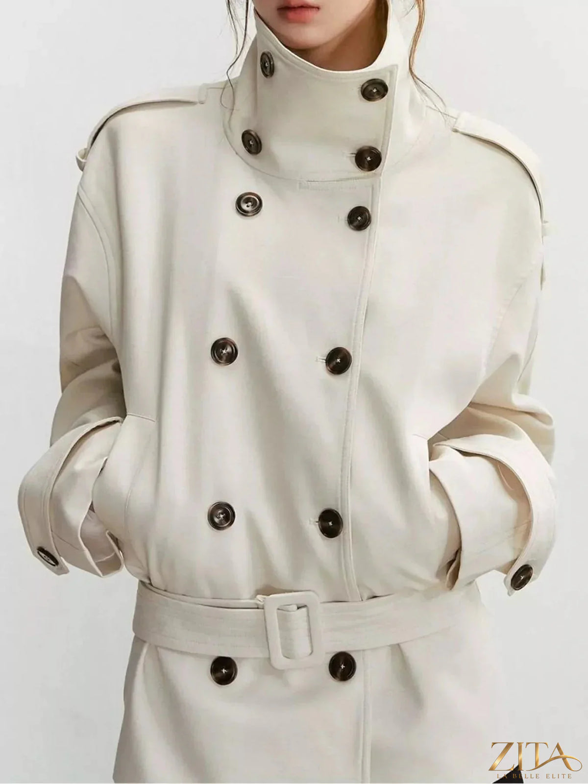 Zita La Belle Elite double-breasted turtleneck trench coat in neutral color, stylish outerwear with button details and belt.