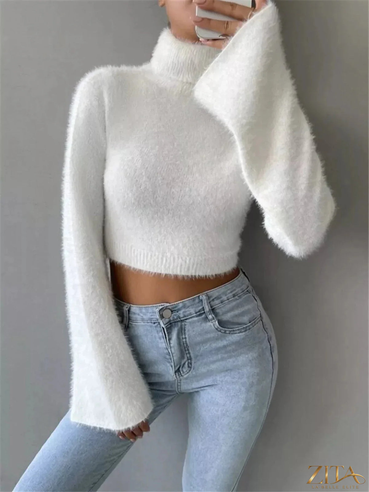 Cream turtleneck flare sleeve sweater by Trendsi, featuring a cozy knit fabric and dramatic bell sleeves.
