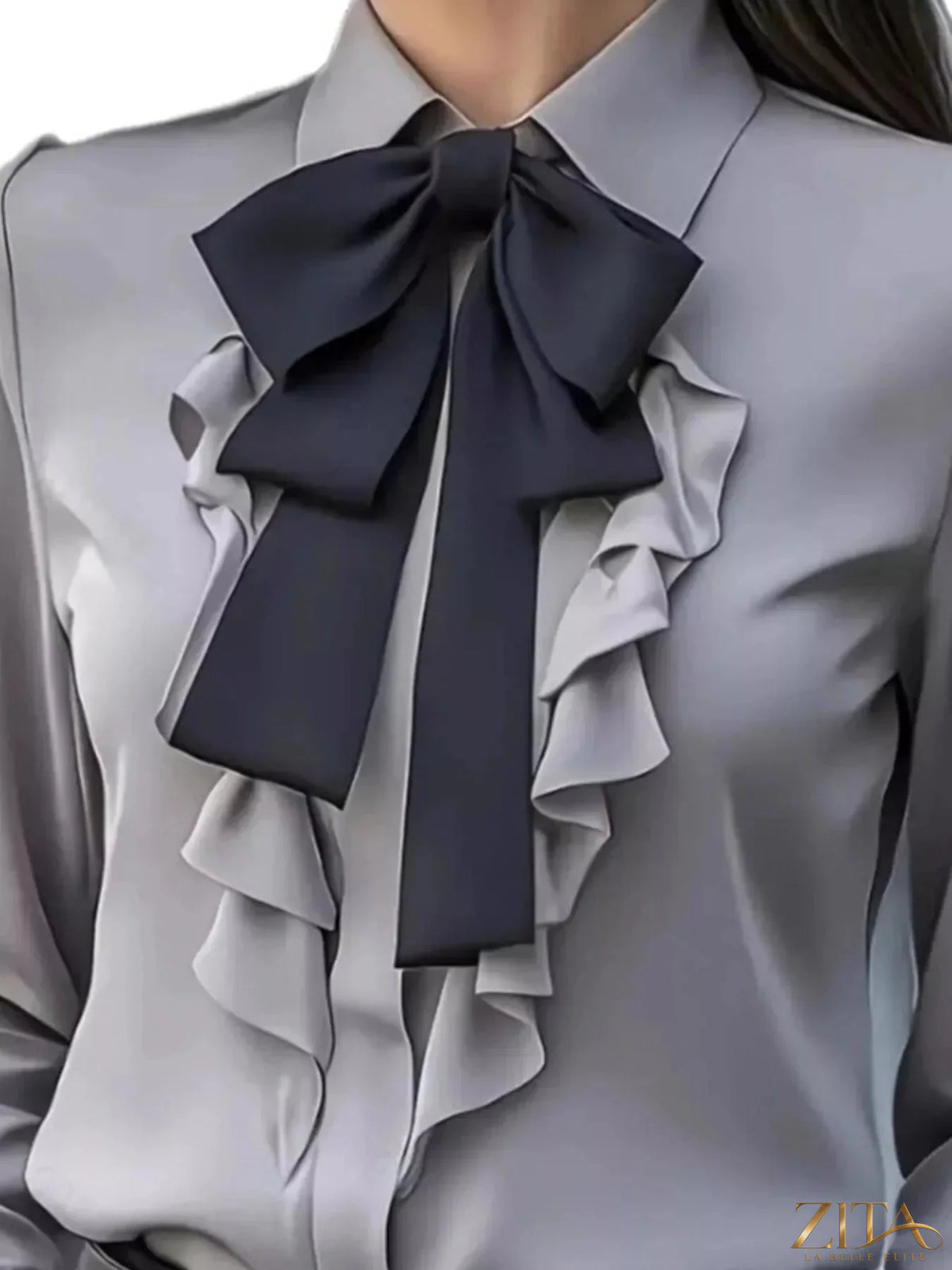 Zita La Belle Elite ruffled tie-front long sleeve blouse with feminine details and soft fabric, shown in a stylish fashion pose.