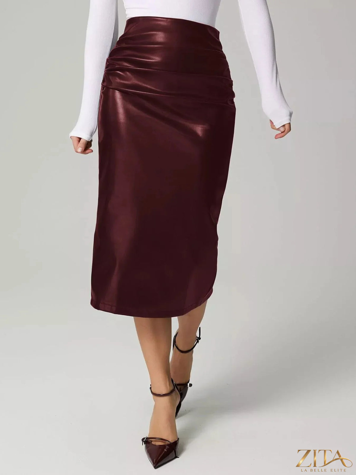 Zita La Belle Elite slit back leather skirt shown on a model, featuring a sleek design and high slit for a stylish look.