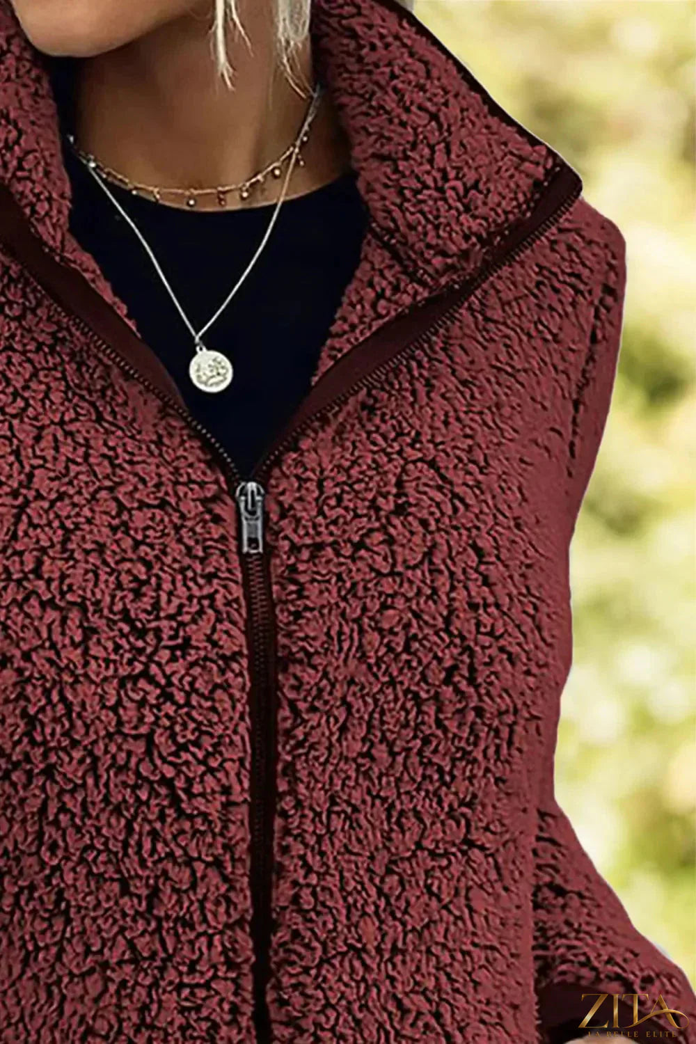 Trendsi pocketed zip-up turtleneck jacket in black, featuring a high collar, front pockets, and a fitted design.