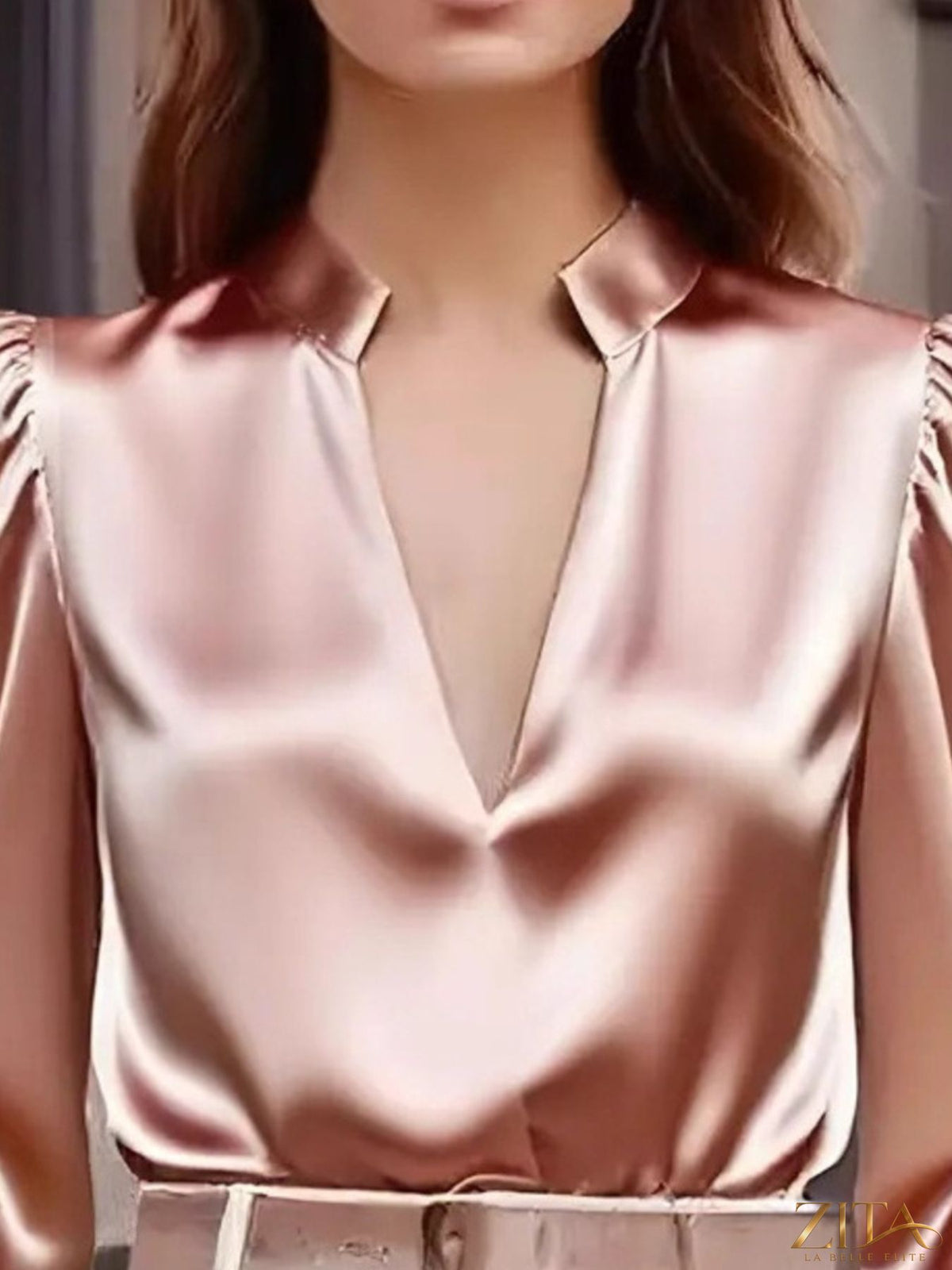 Zita La Belle Elite notched long sleeve blouse with button details, featuring a stylish collar and fitted silhouette.
