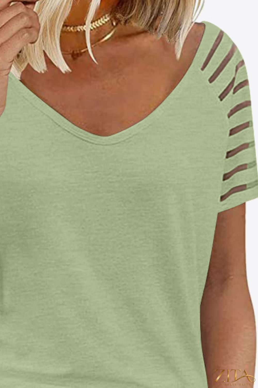 V-Neck raglan sleeve tee in soft fabric with contrasting colored sleeves, styled casually, by Trendsi.