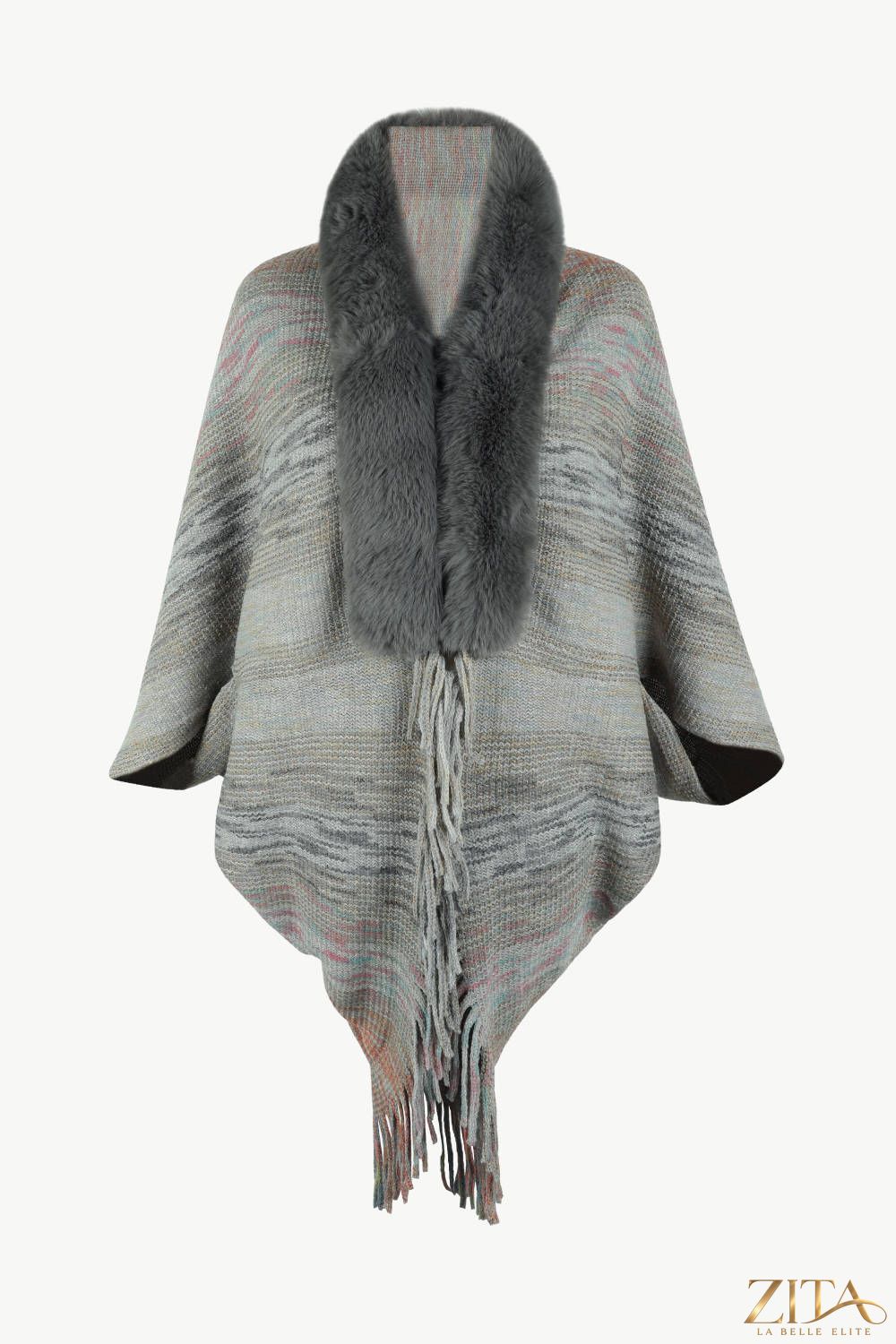 Open front fringe hem poncho by Trendsi, featuring a flowing design with fringe details and a cozy, stylish fit.