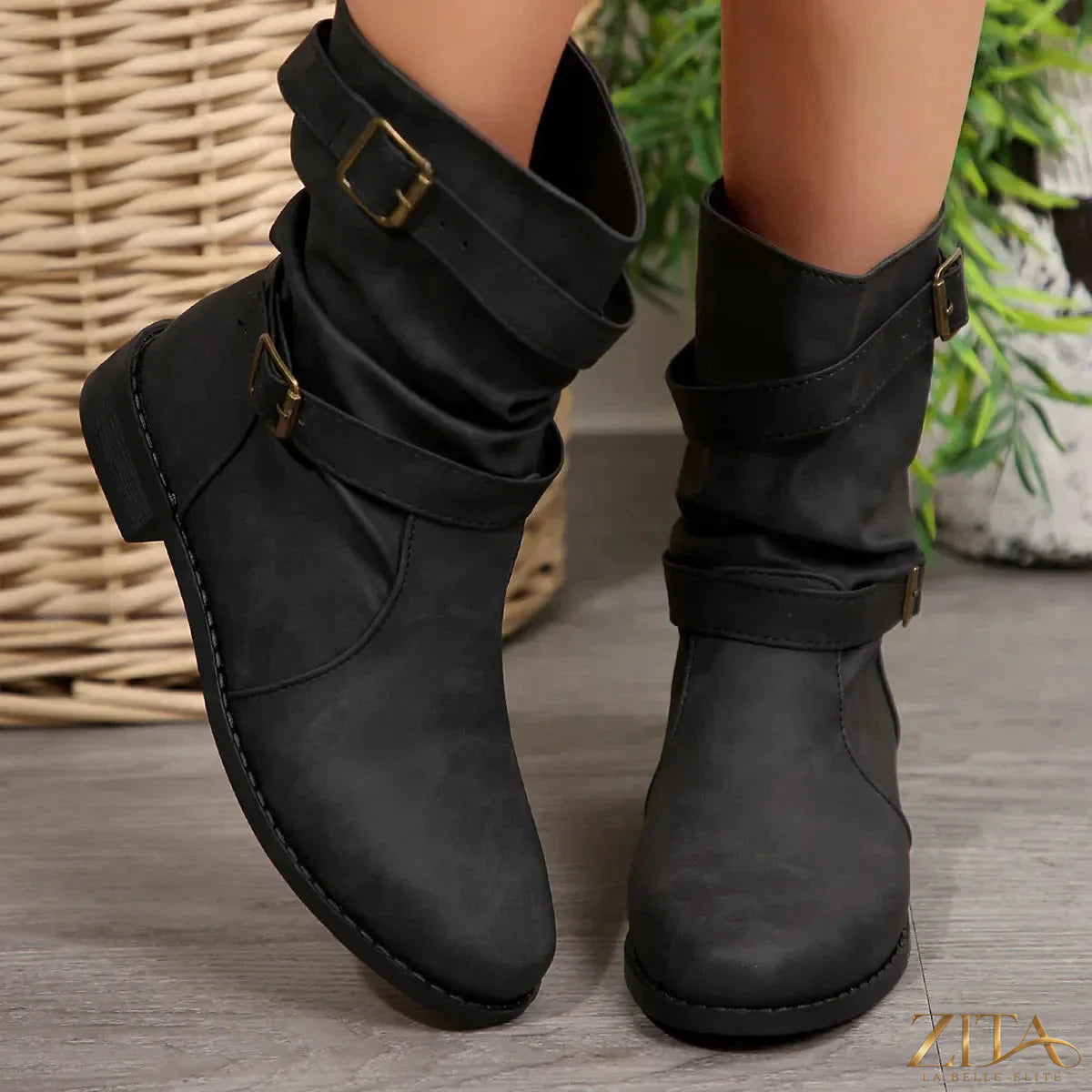 Mid-calf buckle strap boots by Zita La Belle Elite featuring stylish leather with buckle accents and a chunky heel.