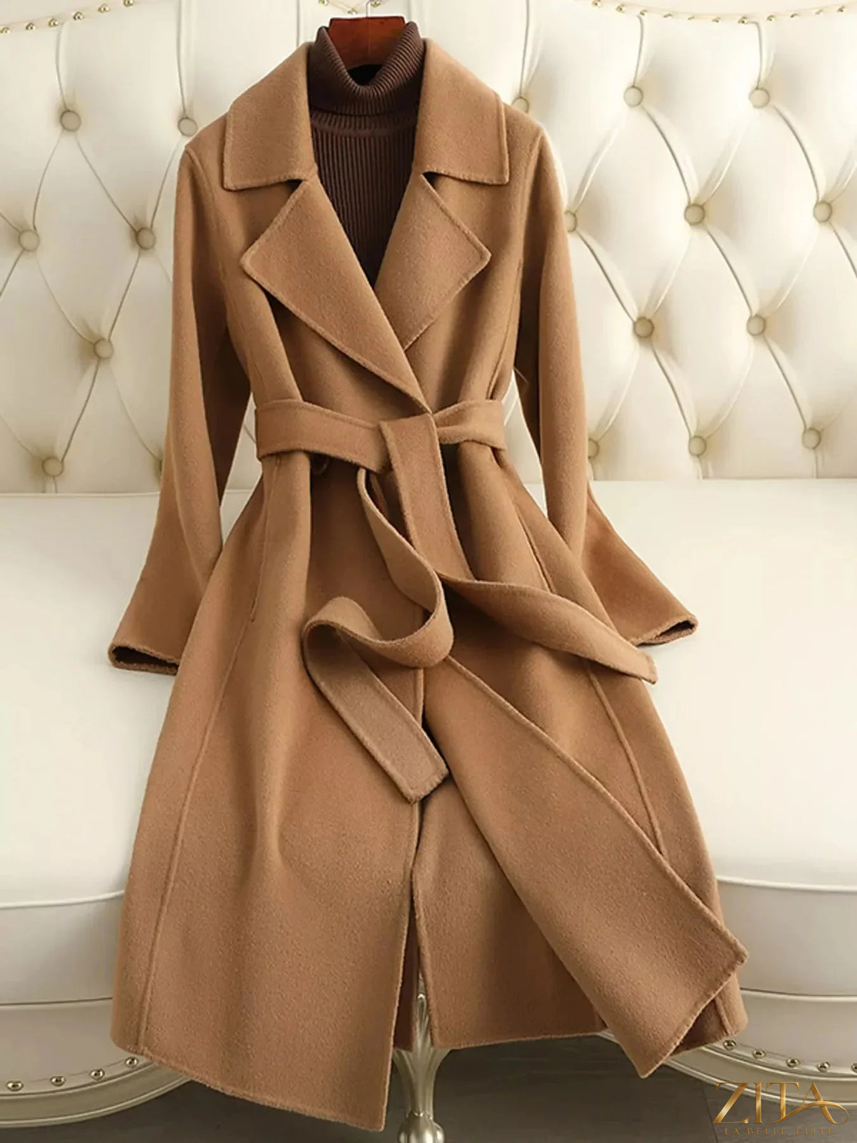 Longline wool coat with waist-defining belt by Zita La Belle Elite, featuring a classic collar and tailored fit.