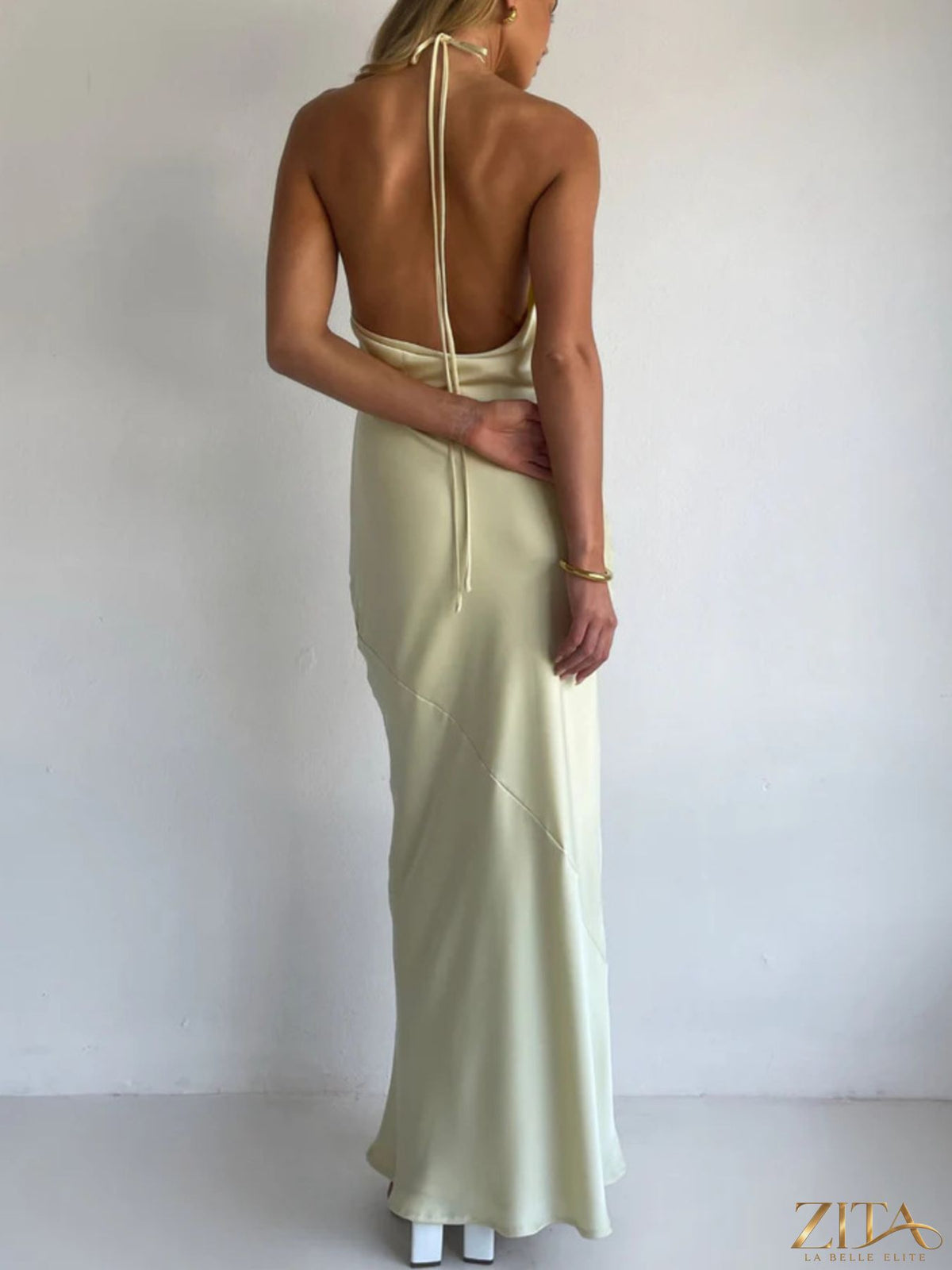 Zita La Belle Elite satin halter neck maxi dress displayed on a mannequin, showcasing its elegant flowing design and luxurious fabric.