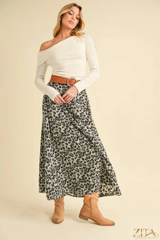 Aemi+Co leopard print midi skirt in black and beige, styled with a high waist and flowy fabric, on a neutral background.