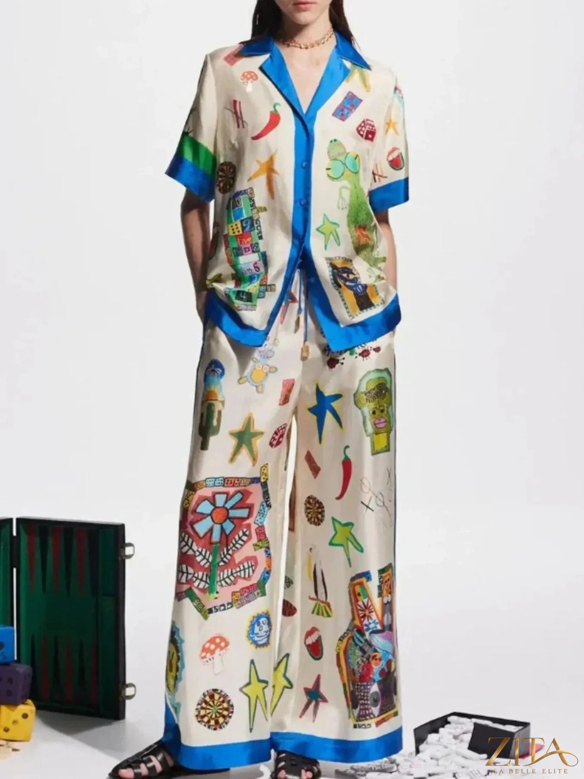 Printed button-up shirt and matching pants set by Zita La Belle Elite, featuring a stylish, coordinated outfit with a vibrant pattern.