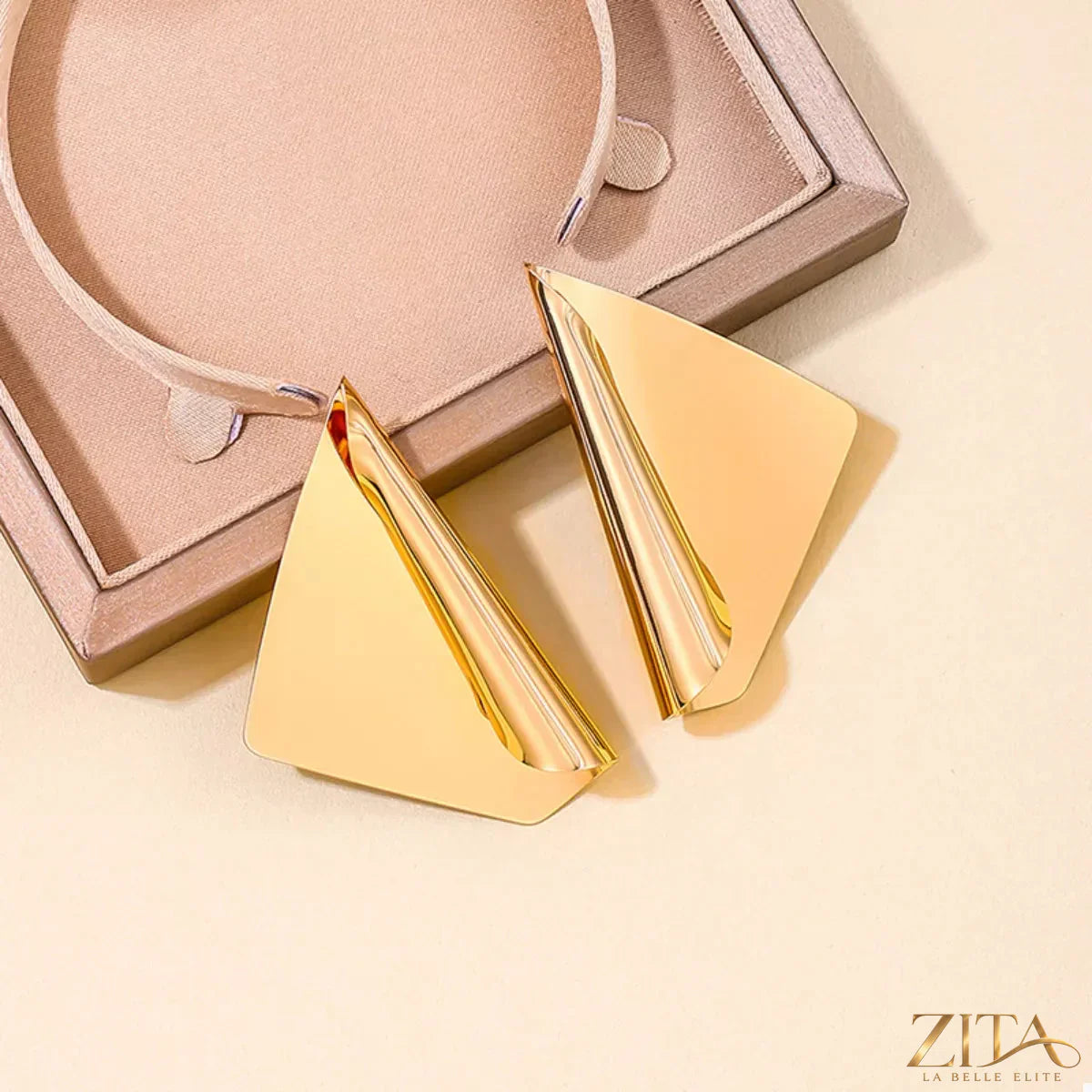 18K gold-plated triangle earrings by Zita La Belle Elite featuring modern geometric design and shiny gold finish.