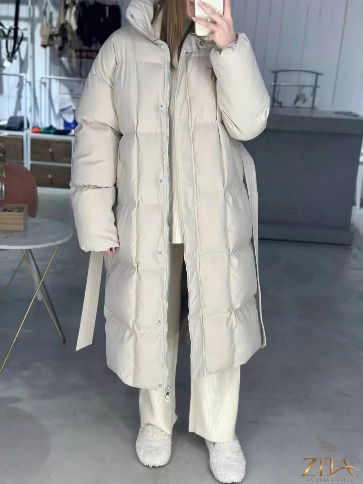 Zita La Belle Elite longline padded winter coat with belt, featuring a hood and quilted design for warmth and style.
