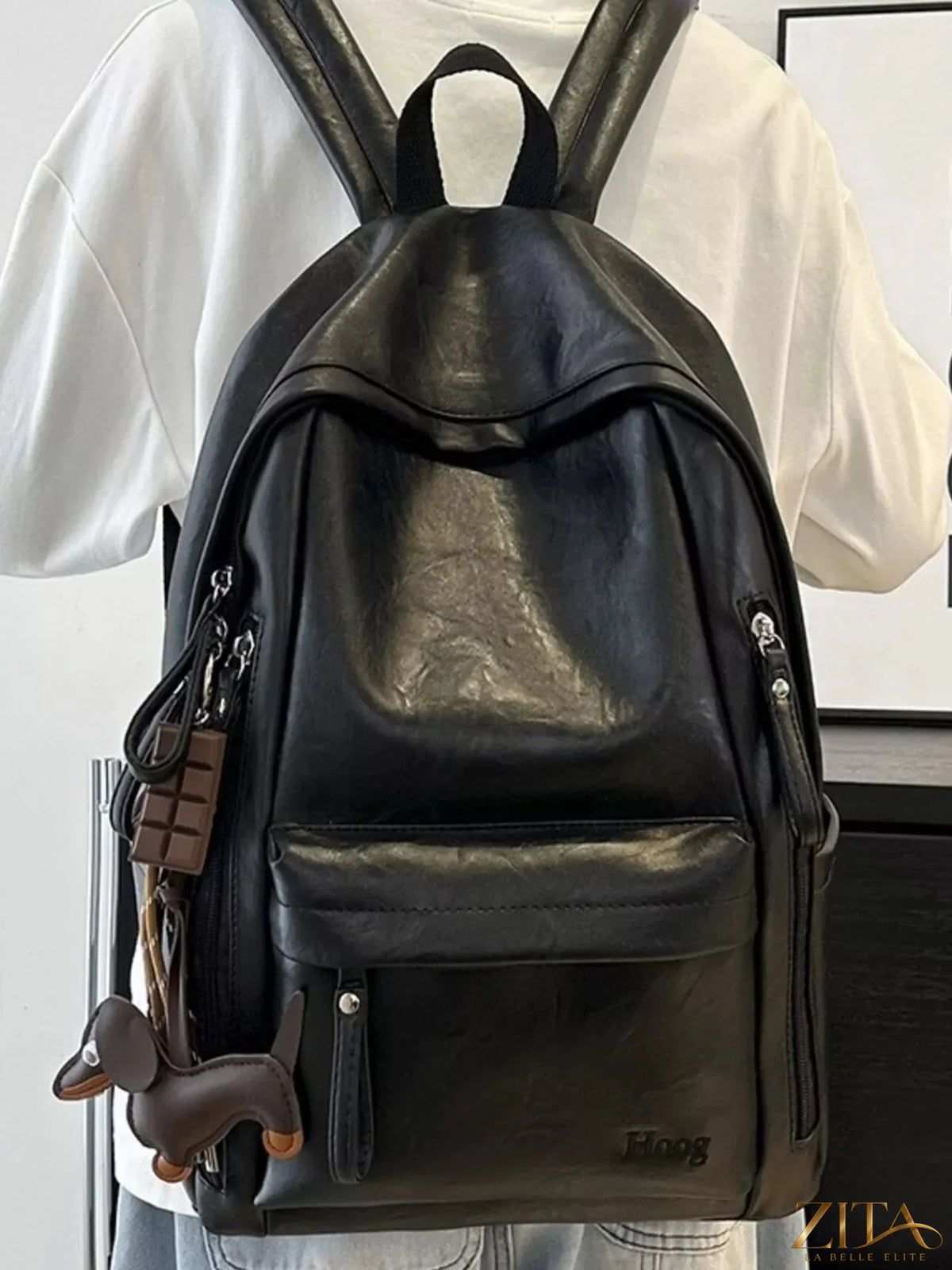 Leather texture backpack bag by Trendsi, featuring a stylish design with adjustable straps and multiple compartments.
