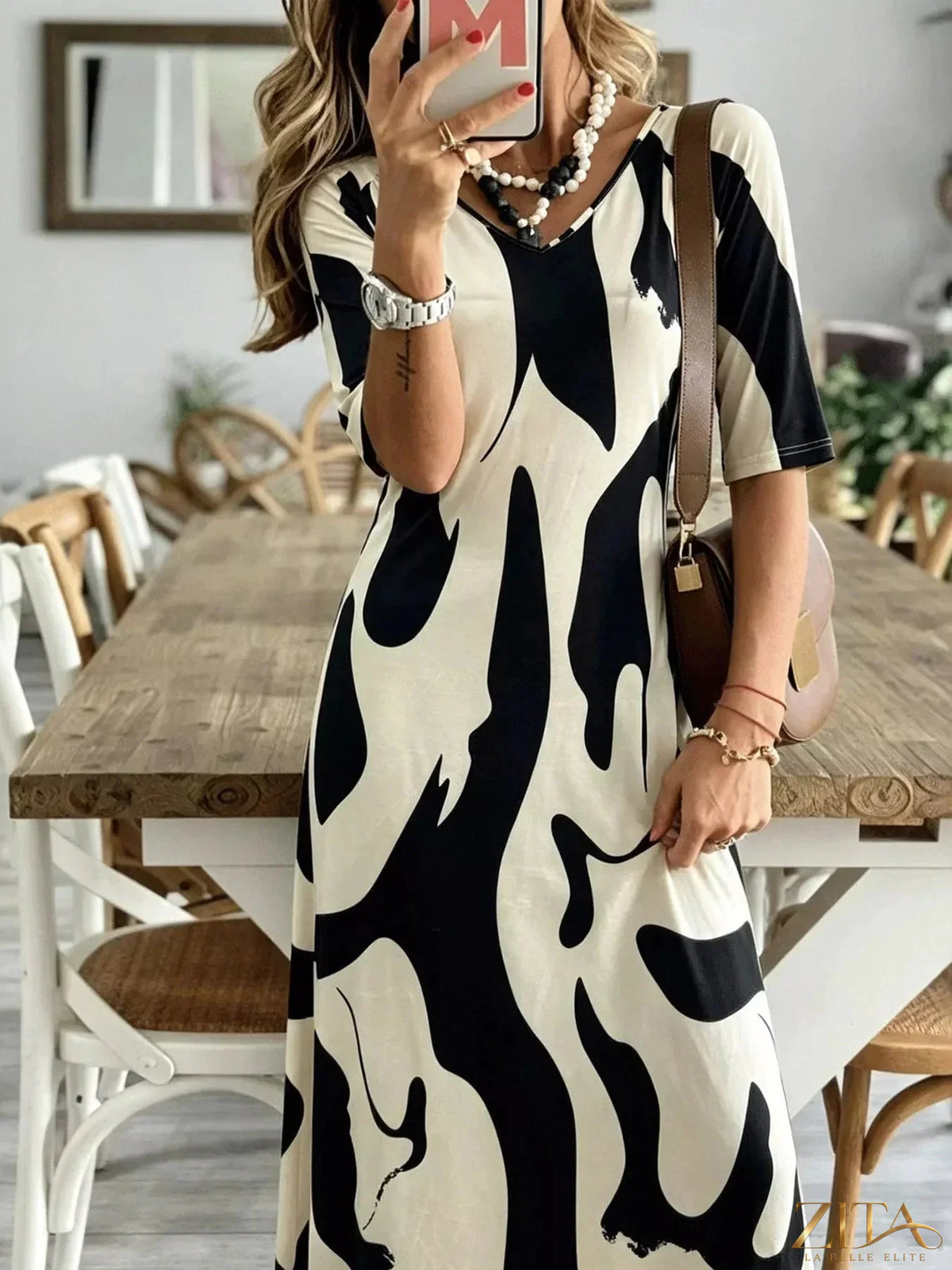 Abstract print casual maxi dress by Zita La Belle Elite featuring a flowing silhouette and vibrant pattern.