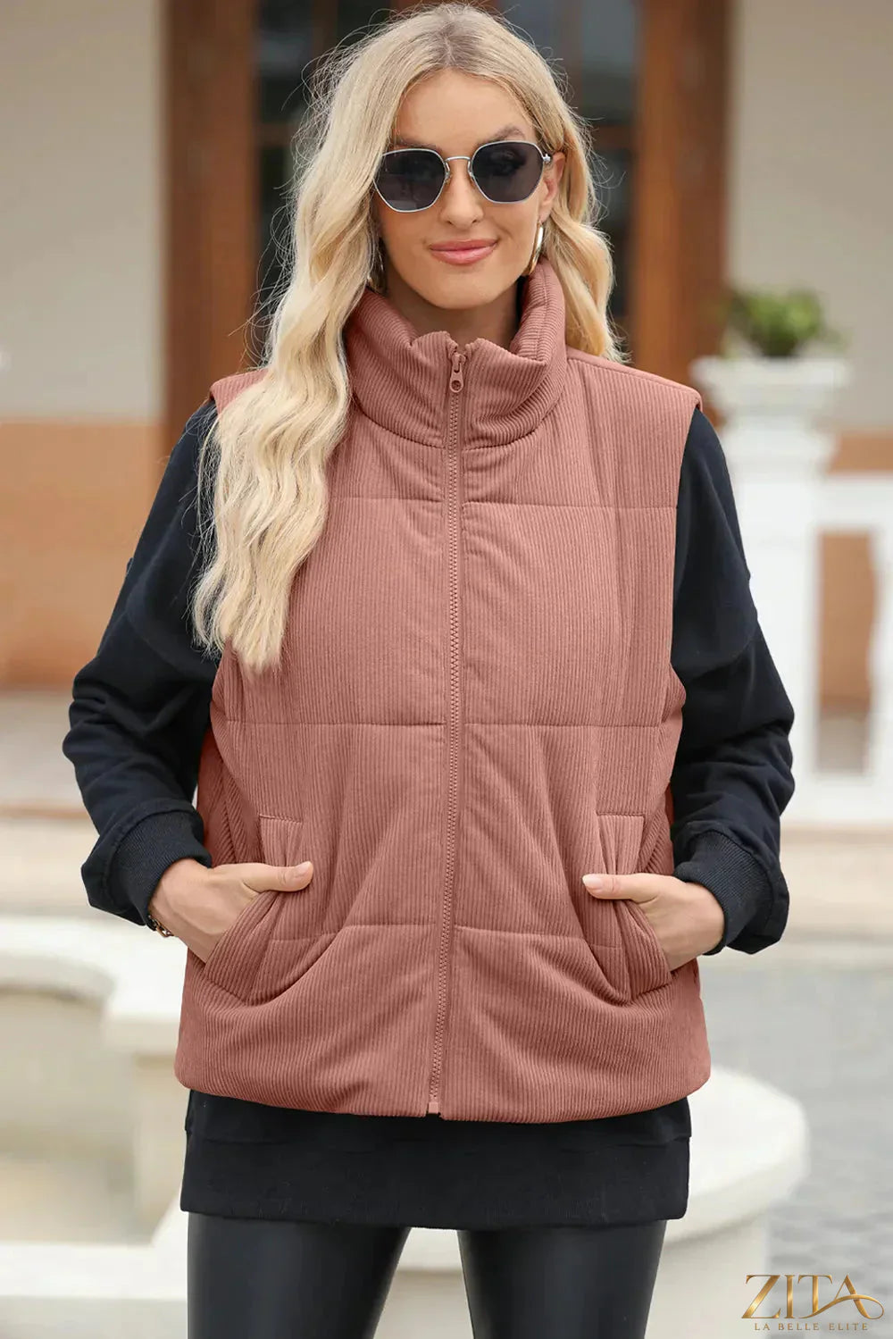 Black pocketed zip-up turtleneck vest coat by Trendsi, featuring a front zipper, cozy turtleneck, and pocket details.