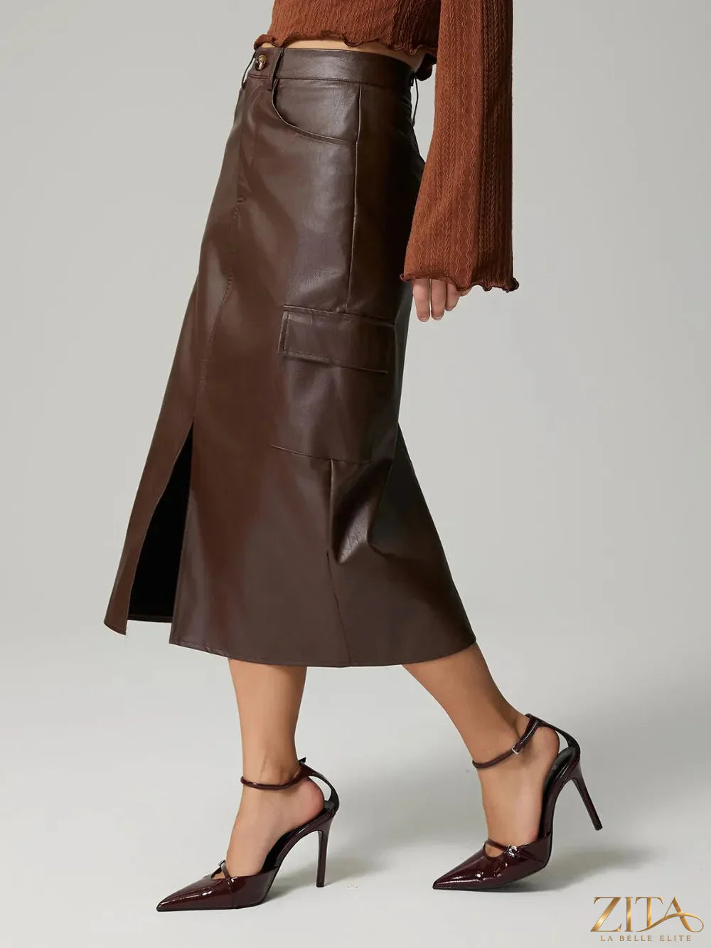 Blue slit midi skirt with pockets from Trendsi, featuring a flowy fabric and stylish side slit for a trendy look.