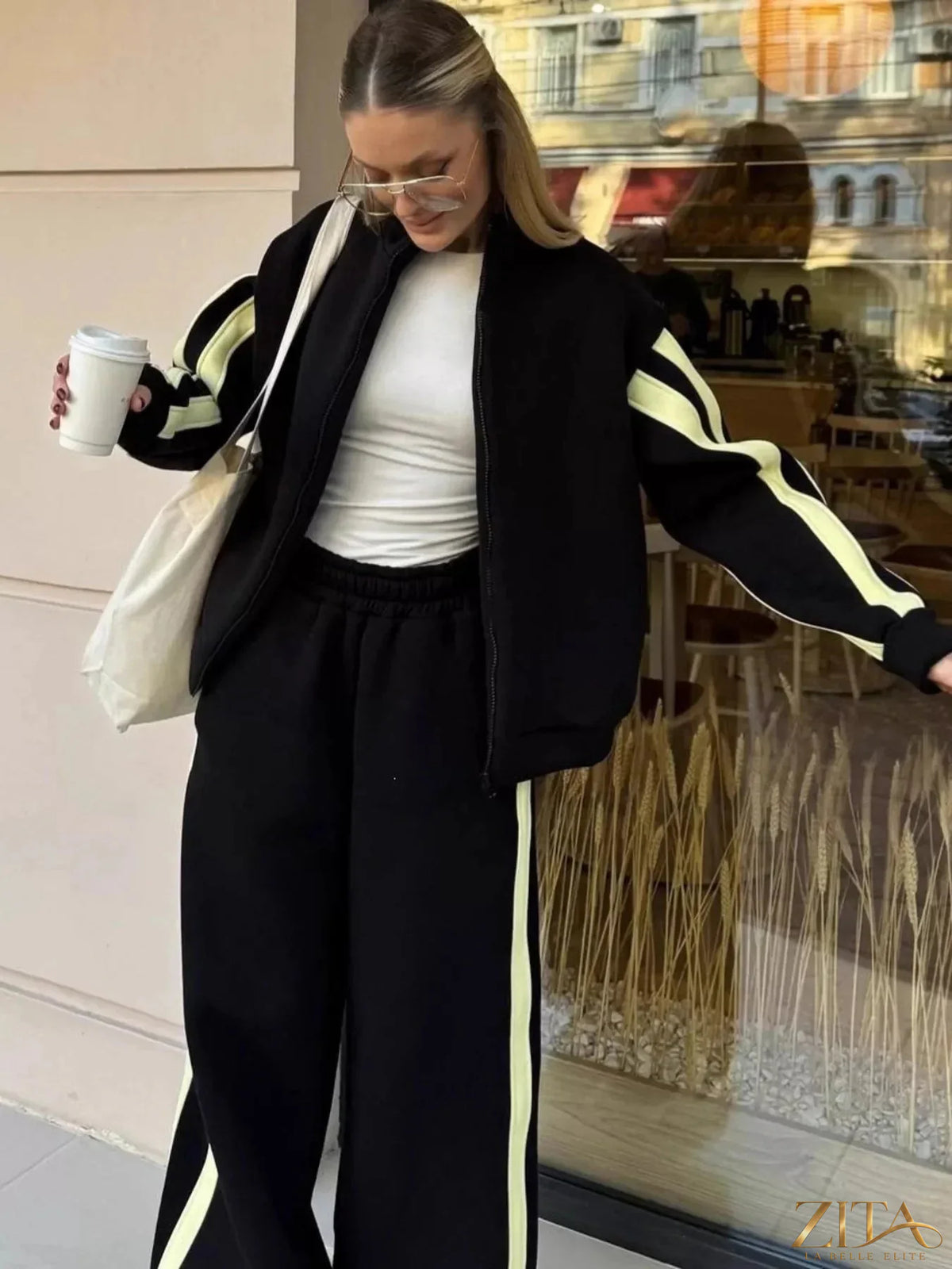 Zita La Belle Elite contrast striped zip-up top and pants set, featuring a stylish matching athleticwear ensemble with bold stripes.