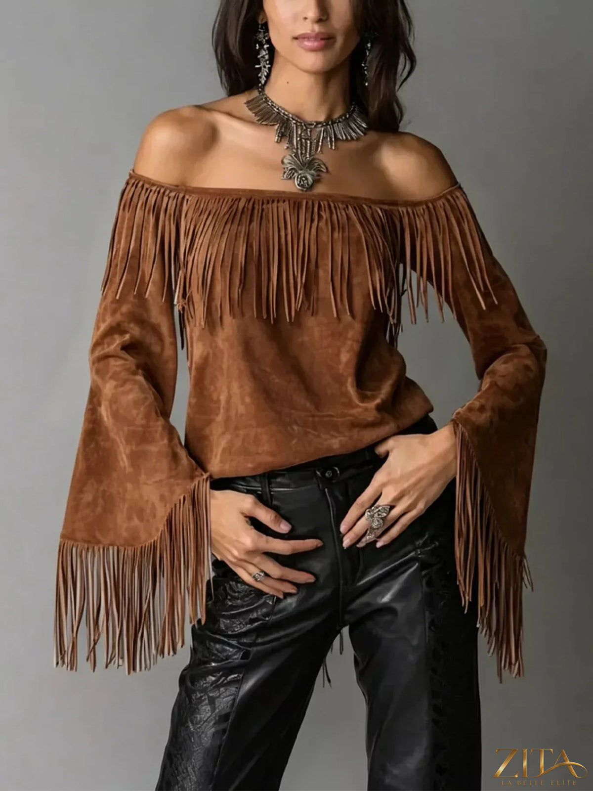 Plus size fringed off-shoulder T-shirt from Trendsi featuring a full-size fit and stylish fringe detail.