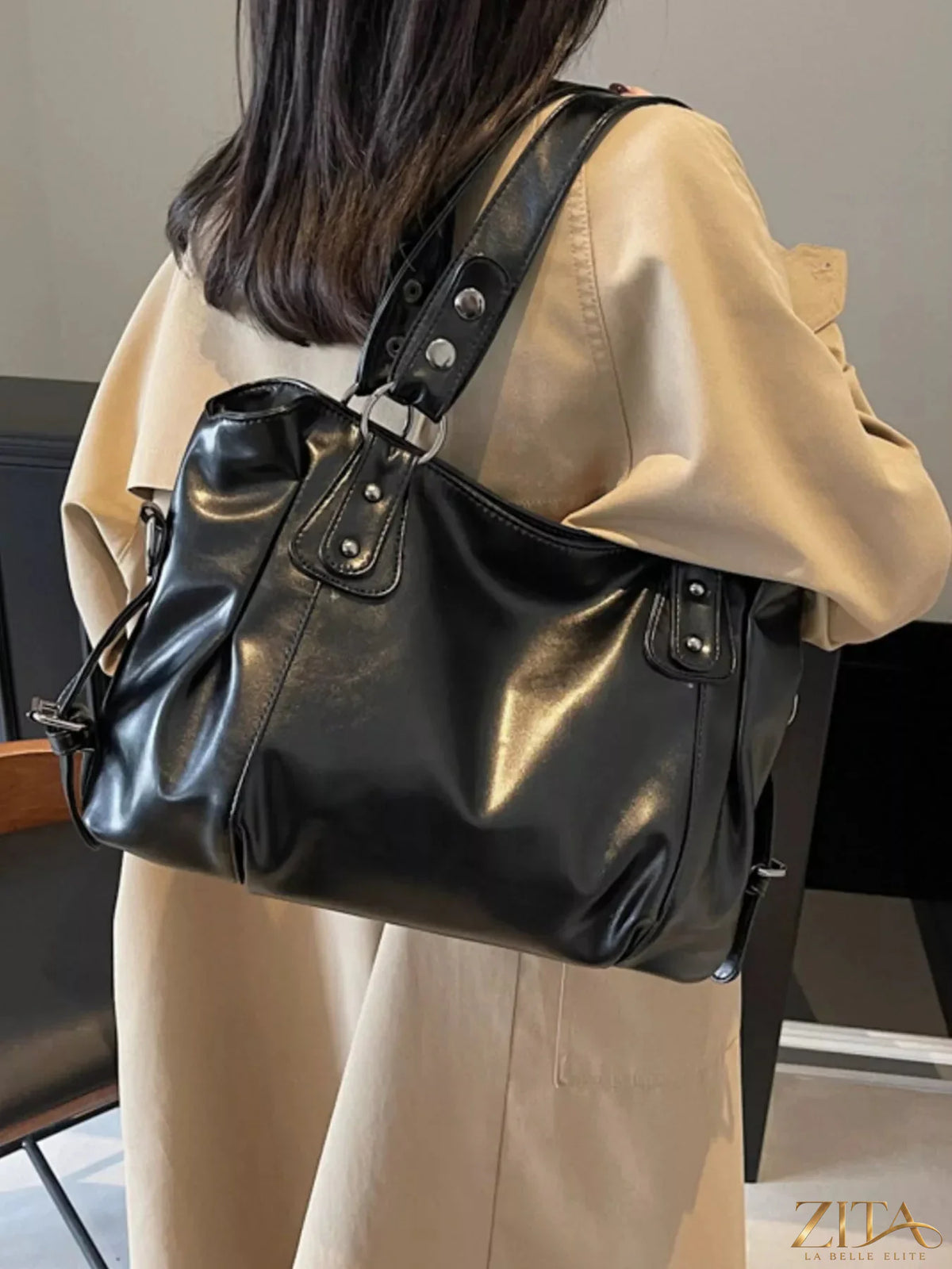 Vintage-style leather handbag by Trendsi featuring a classic design with sturdy handles and elegant detailing.